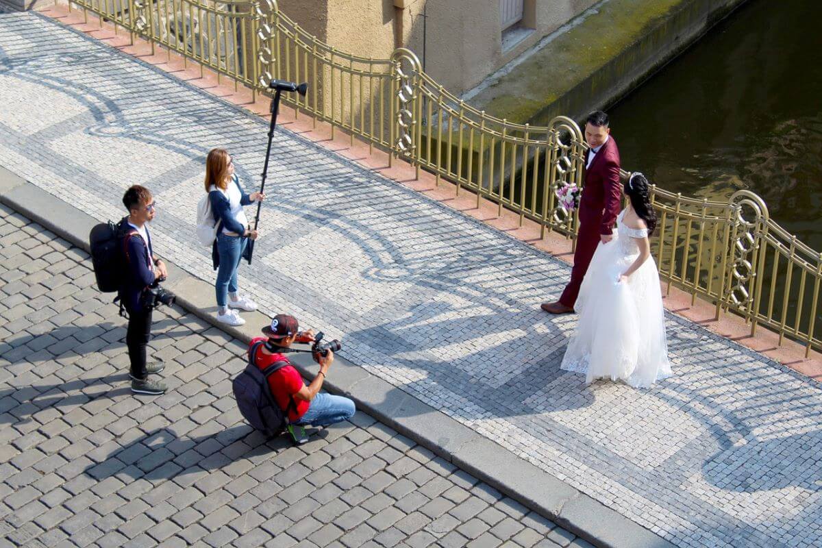 Bride and Groom being photographed on their wedding day